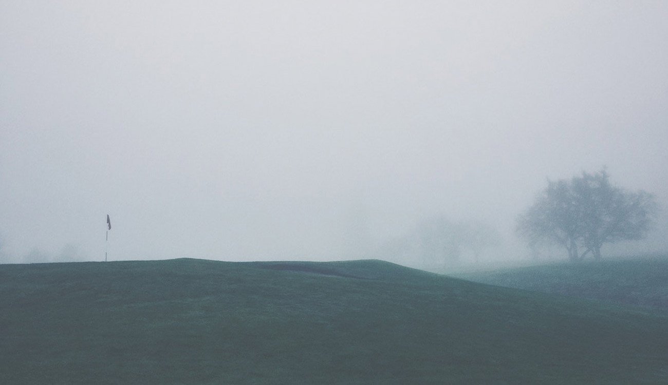 Golf course in deep fog